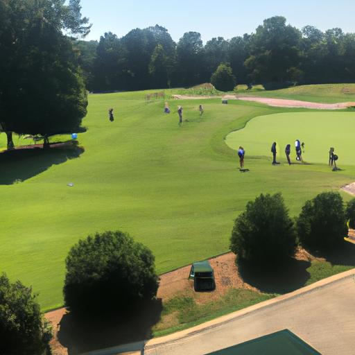 Group of enthusiastic golfers participating in a golf clinic led by experienced instructors at Golf Galaxy in Winston Salem.