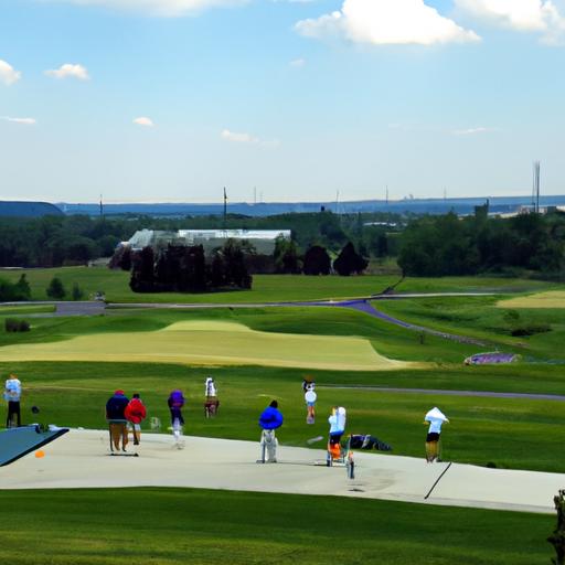 Golfers honing their skills at the Golf Galaxy driving range in Canton, Ohio.